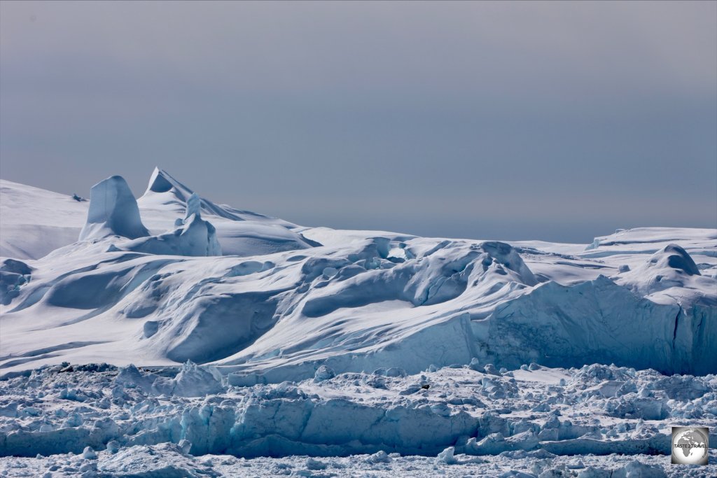 Icebergs on top of icebergs! The larger icebergs block the mouth of the Icefjord, resulting in an iceberg traffic jam!