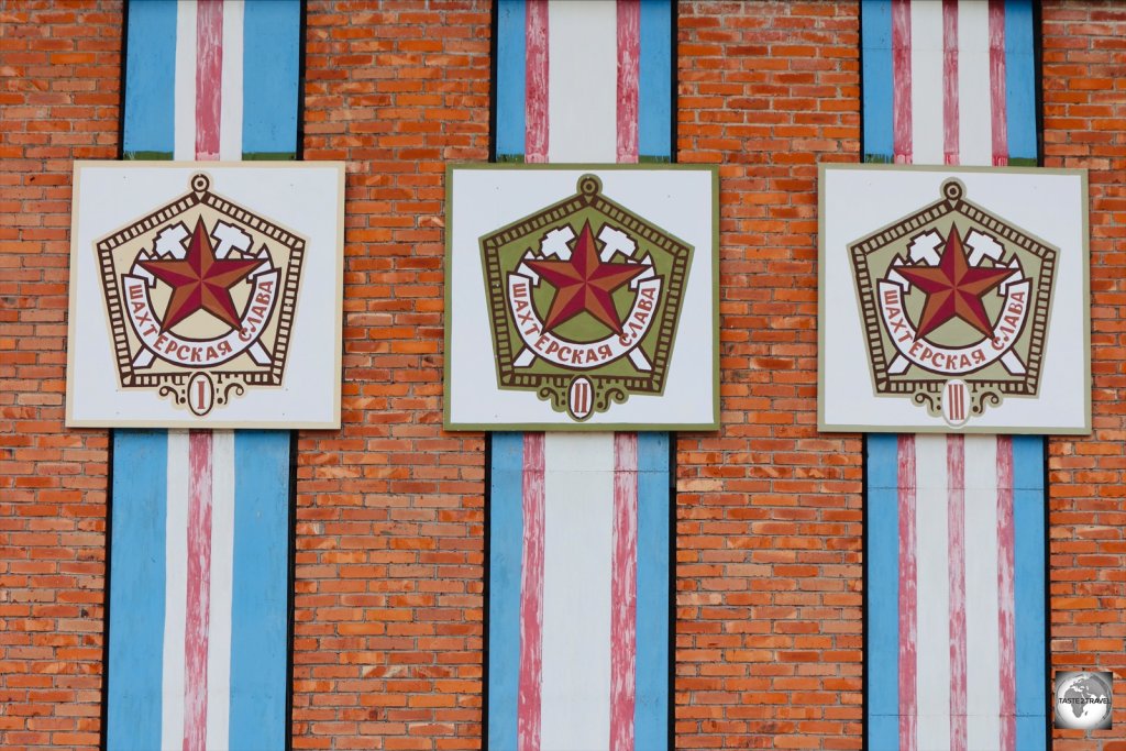 Soviet emblems on the wall of the cultural hall.