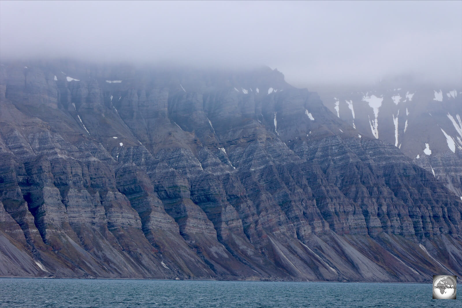 The world's northernmost Fjord, the Billefjorden, is lined by an uninterrupted range of towering mountain peaks.