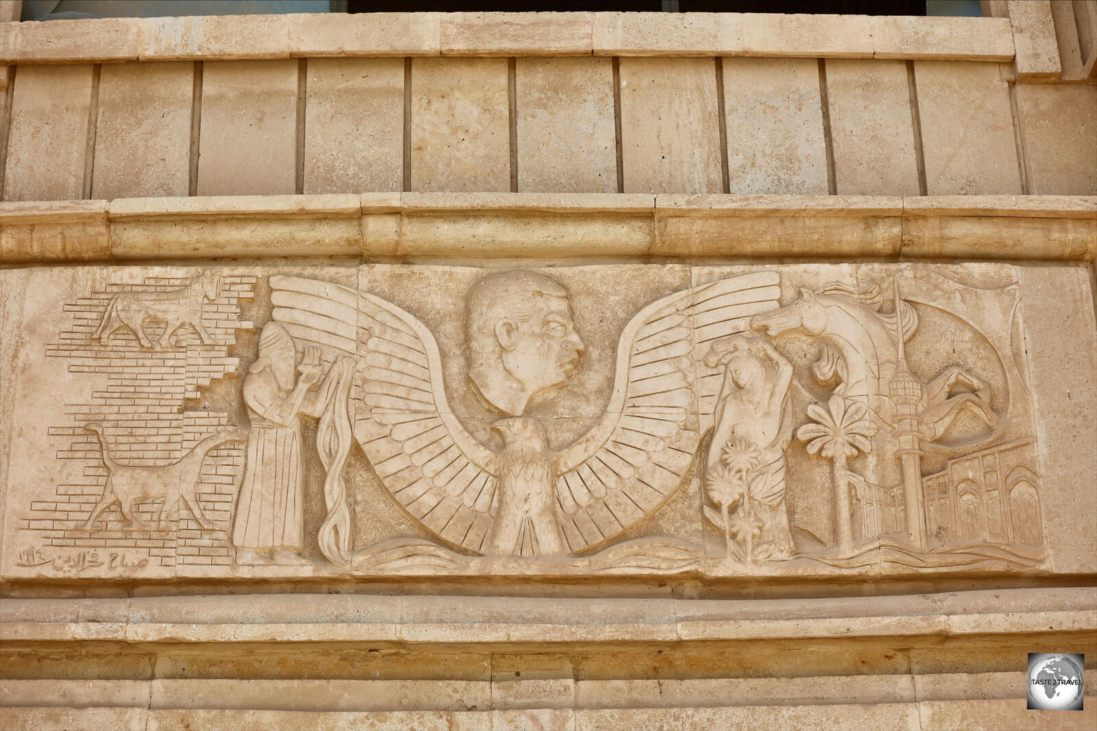 A palace door lintel features a bust of Saddam Hussein in an ancient, Babylonian, setting.