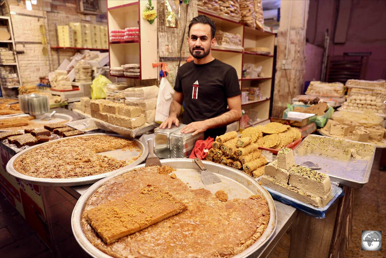 A vendor at Najaf souk, selling trays of sweet and delicious 'Halva Dehin', a speciality of Najaf.
