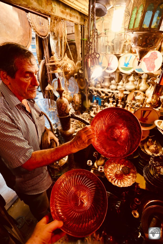 Copper merchant in the Al-Safafeer souk, Baghdad.