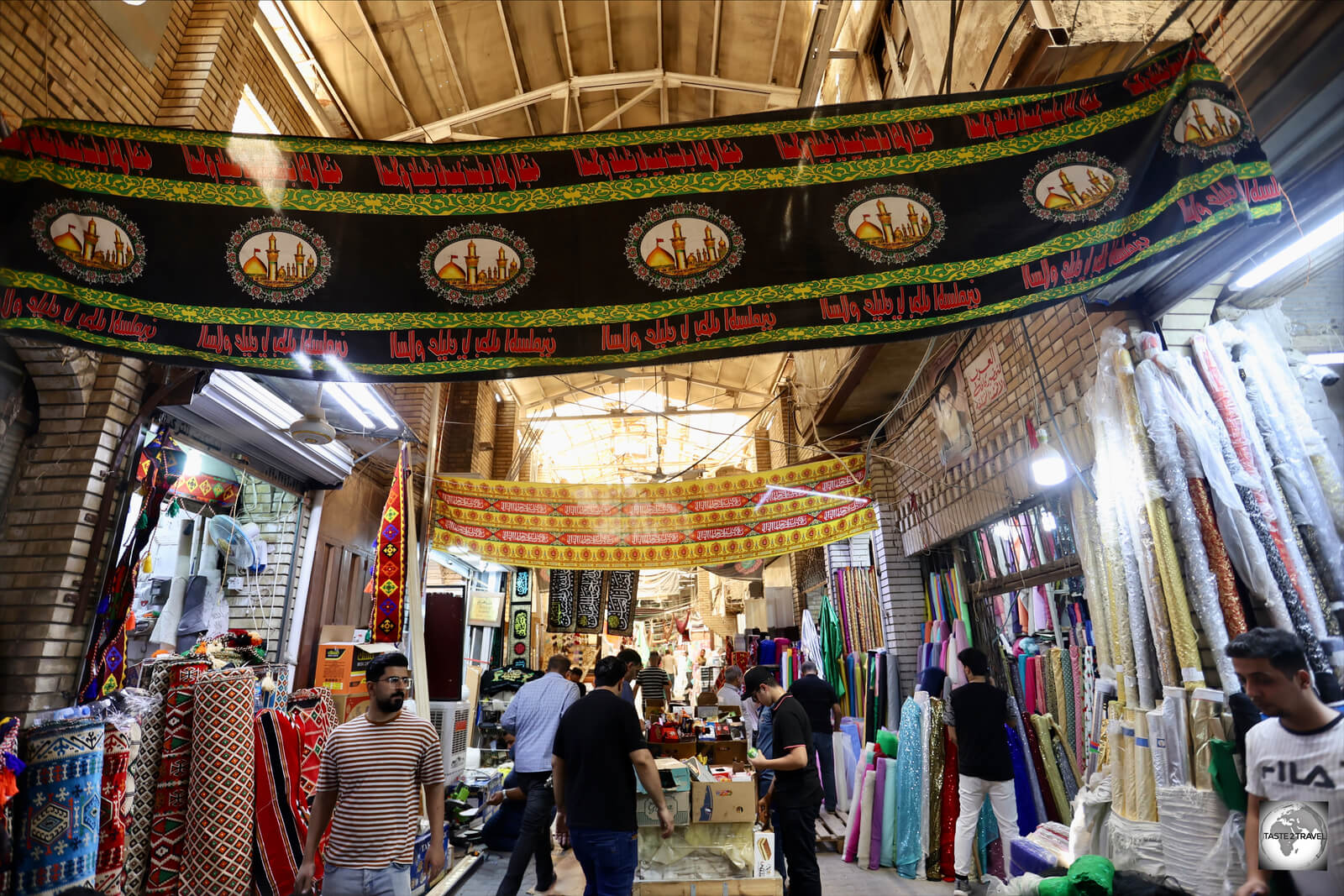 A view of Baghdad souk with Shia flags flying overhead.