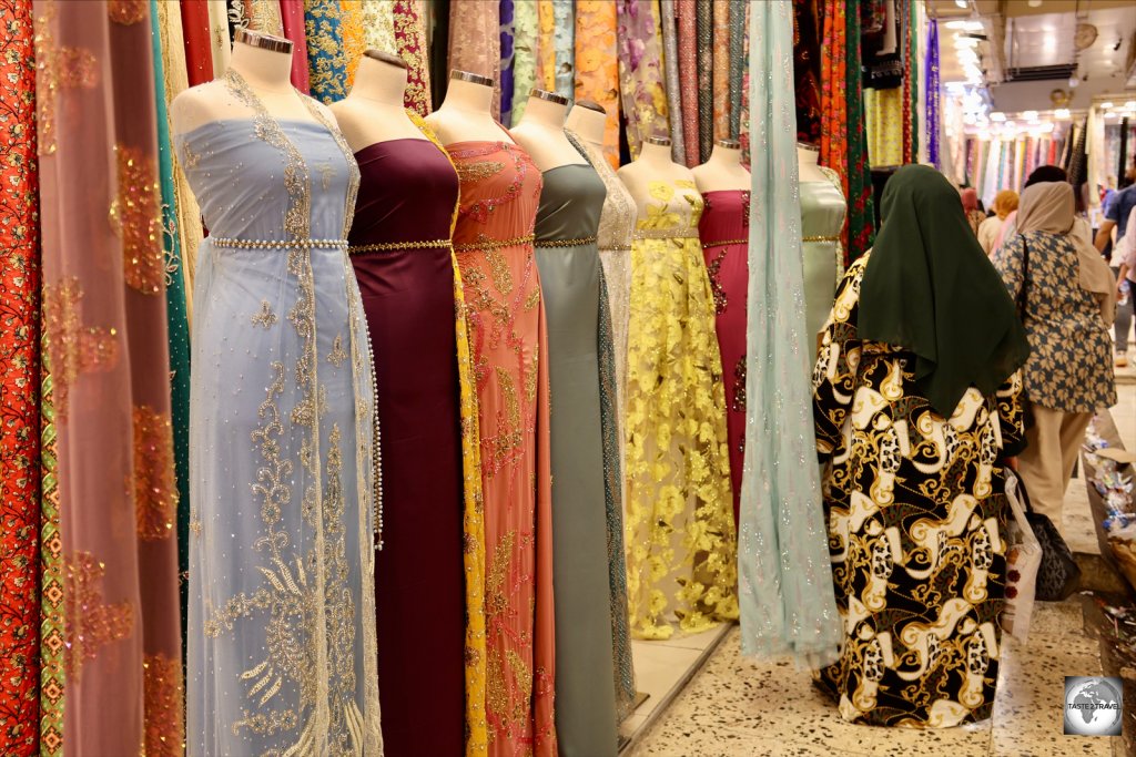Women, shopping for clothes and textiles at Sulaimaniyah souk.