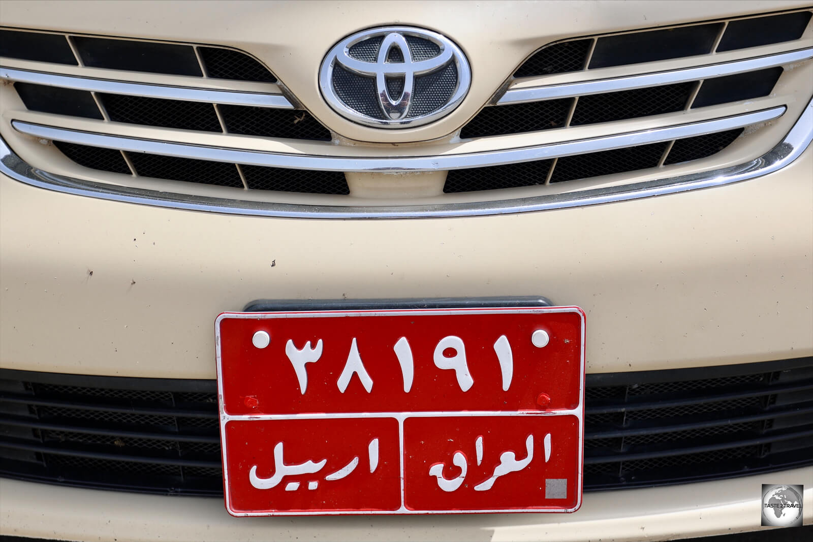 Taxis in Iraq can be identified by their red license plates.