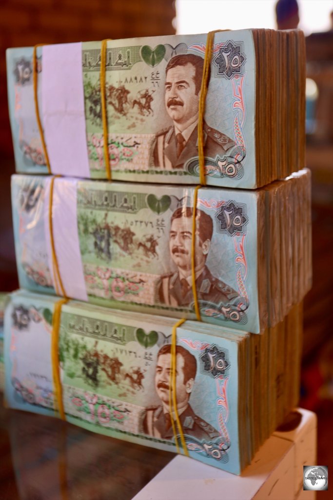 Wads of Saddam Hussein dinars at a money exchange in Erbil souk.