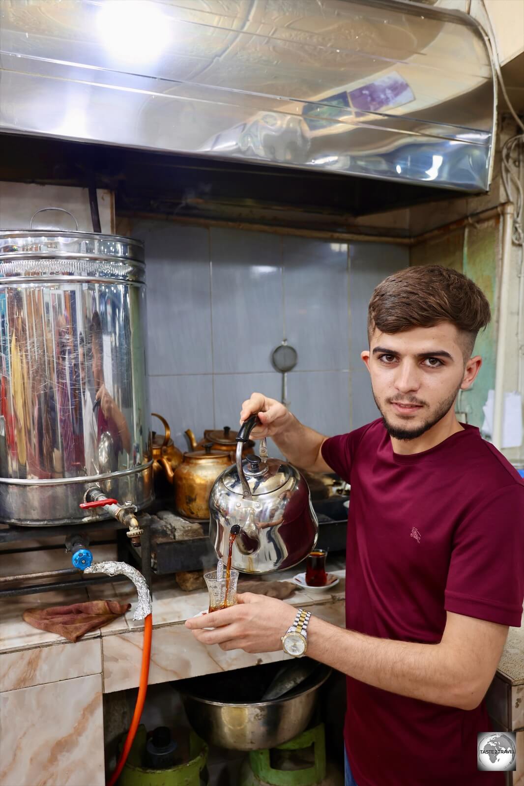 One of numerous tea sellers inside Erbil Souk. Notice that he can pour while posing for the camera. Talented!
