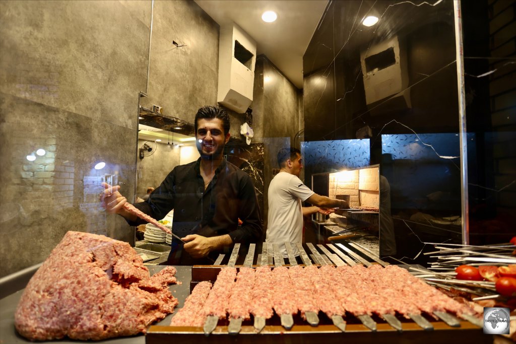 Mince-meat shish kebabs, being prepared for lunch, in a restaurant inside Erbil souk.