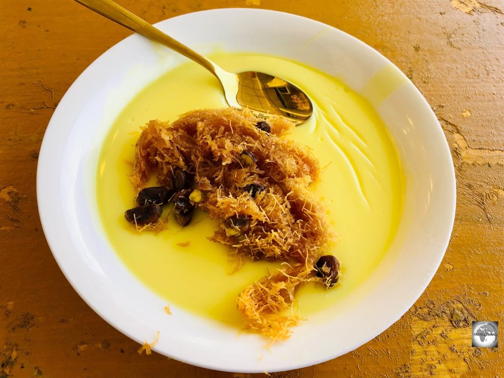 Truly divine! Baklava crumbled over a bowl of warm custard in Sulaimaniyah souk!
