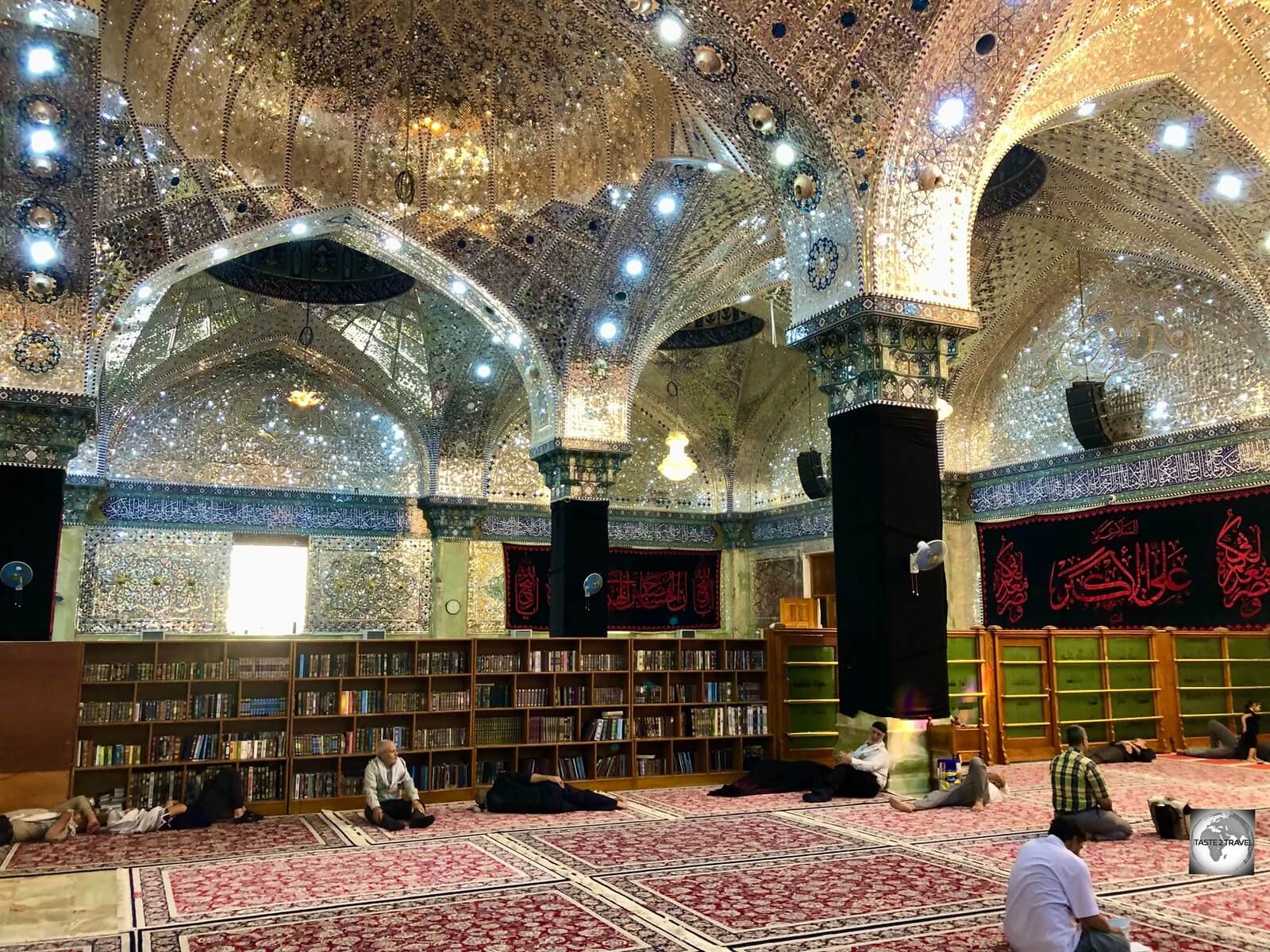 Worshippers, relaxing on the carpeted floor of the air-conditioned Al-Askari Shrine in Samarra.