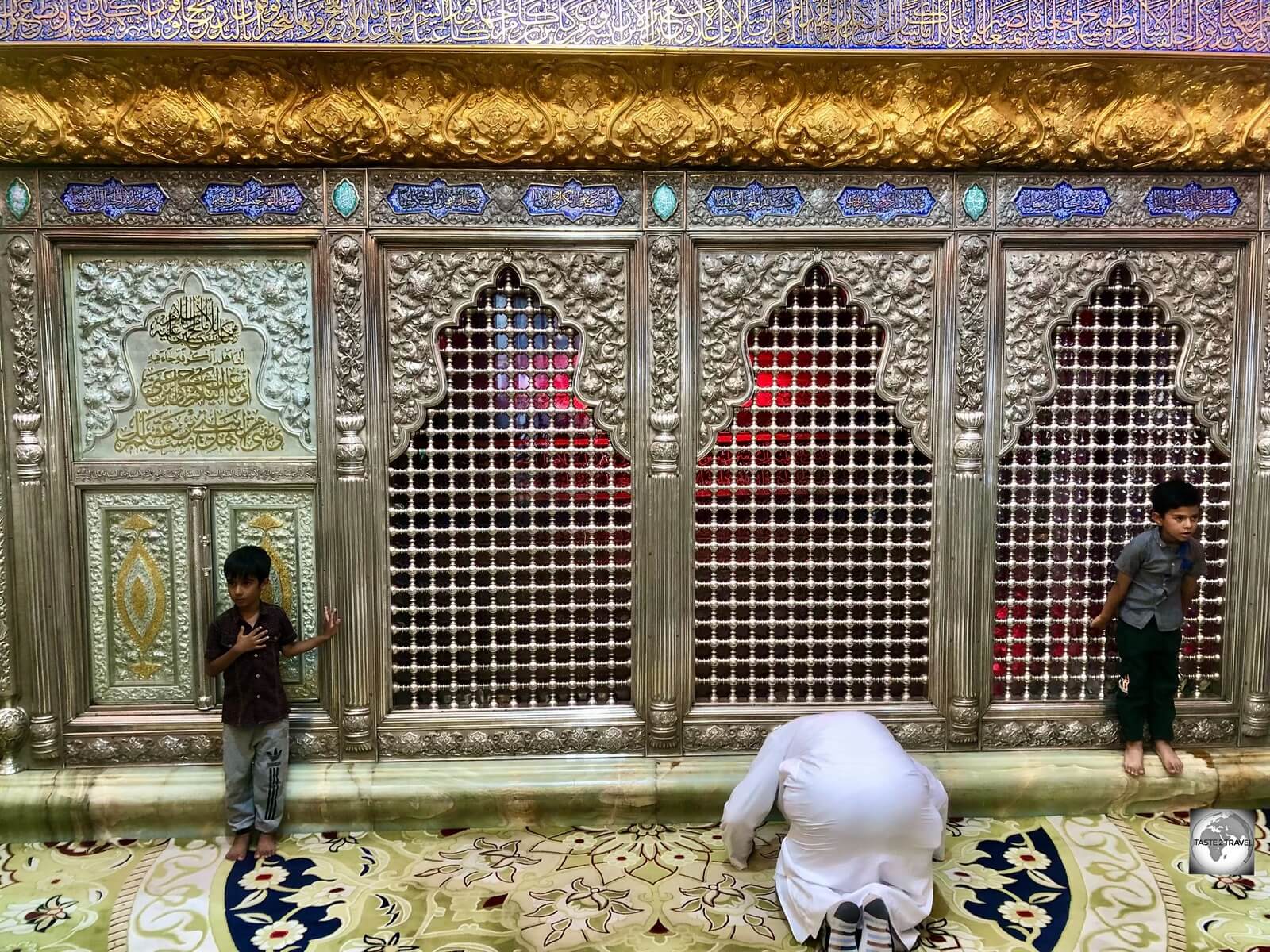 A pilgrim prays at the Shrine of Muslim Bin Aqeel, inside the Grand Mosque of Kufa.