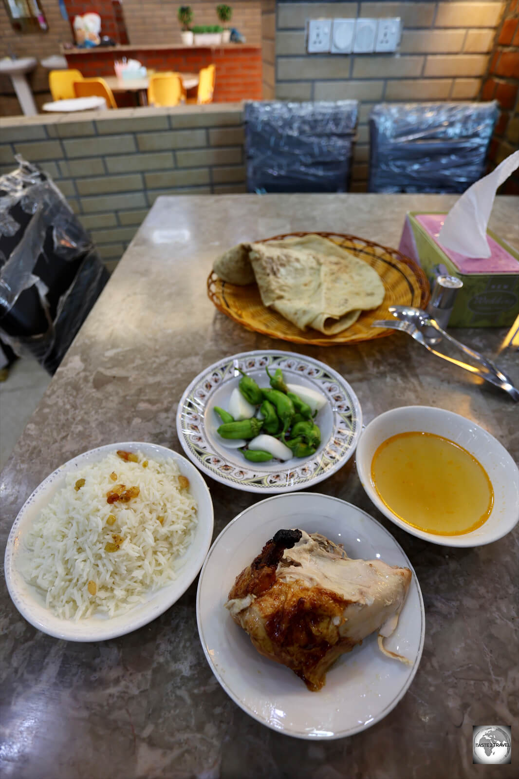Lunch in Halabja - roast chicken, served with stewed apricots and other sides.
