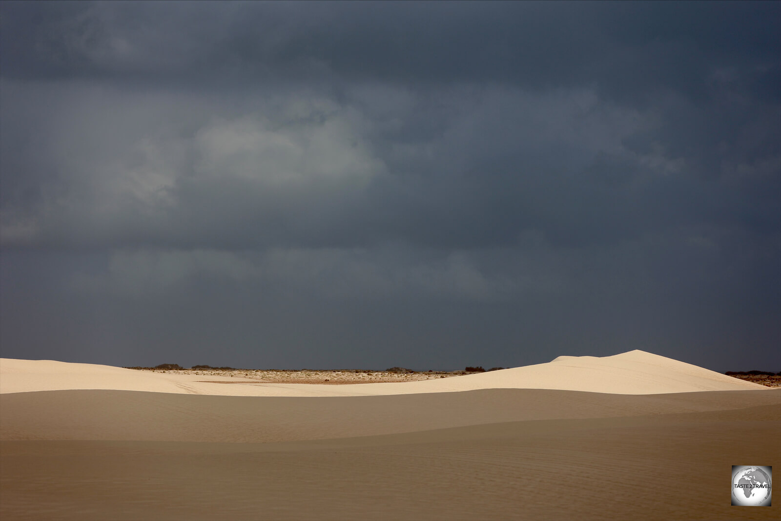 Dramatic skies over the Hayf and Zahek sand dunes.