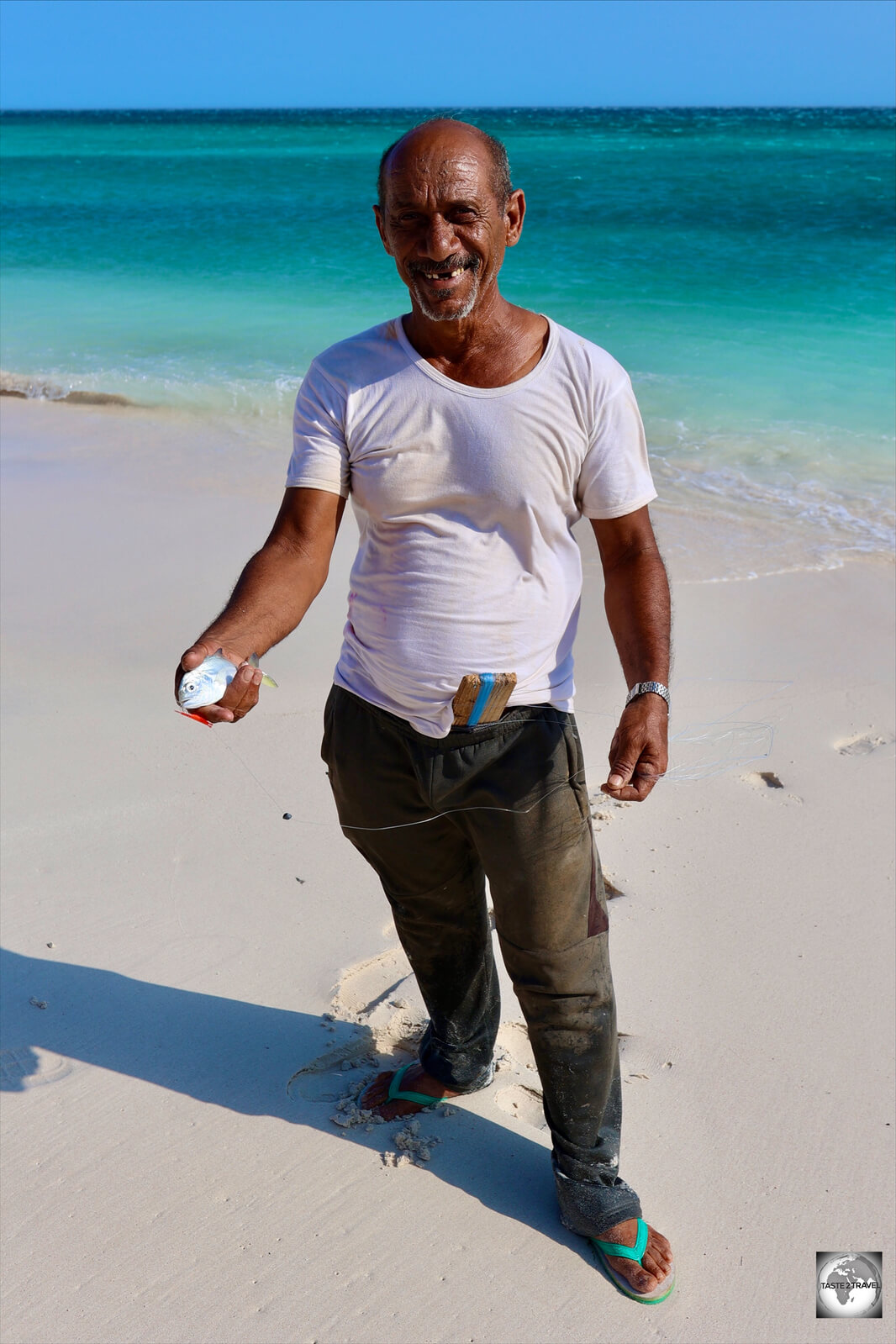 A fisherman at Hala beach, showing me his catch, before he put it in his pocket.