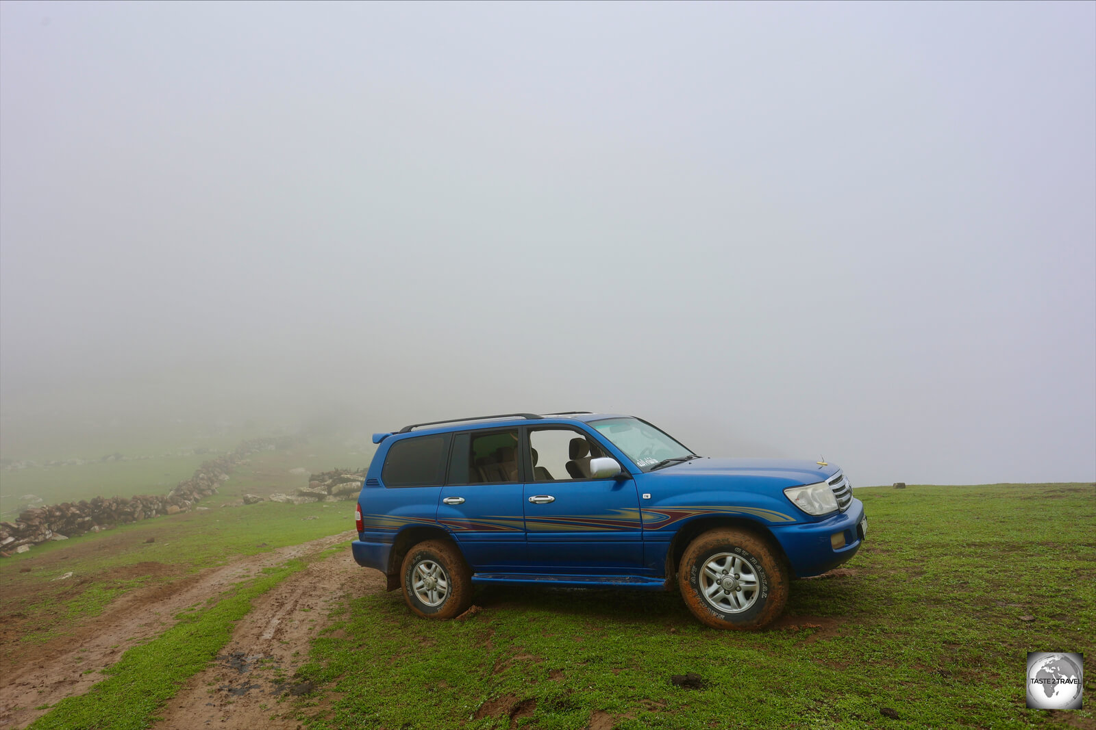 Our 4WD, shrouded in fog and cloud, at the top of the Hajhir Mountains.