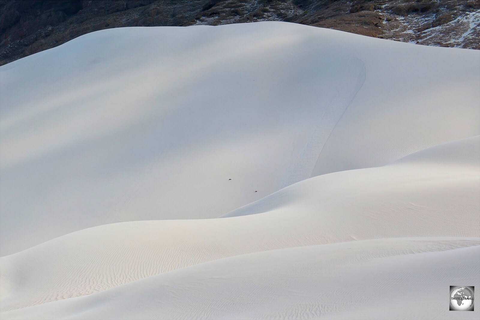 Like large piles of talcum powder, the sand dunes at Arher beach are 150 metres (500 ft) in height).