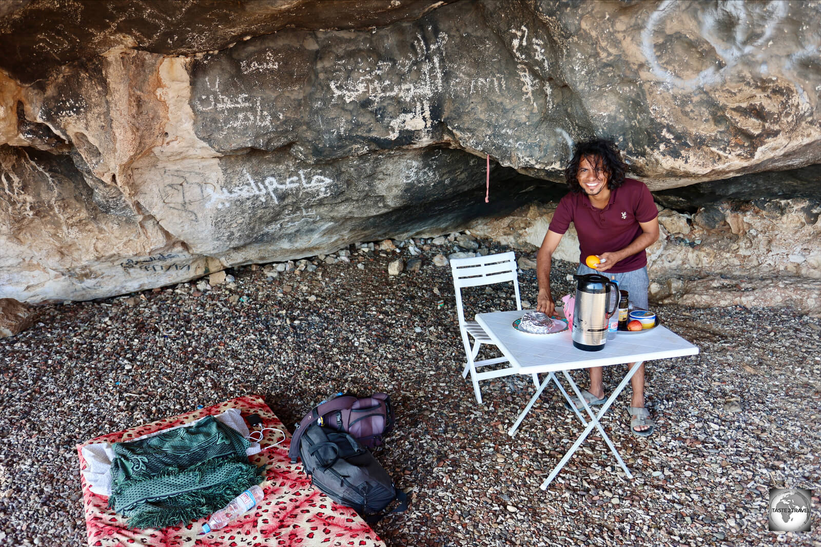My guide, Ali, serving breakfast in the cave campsite.
