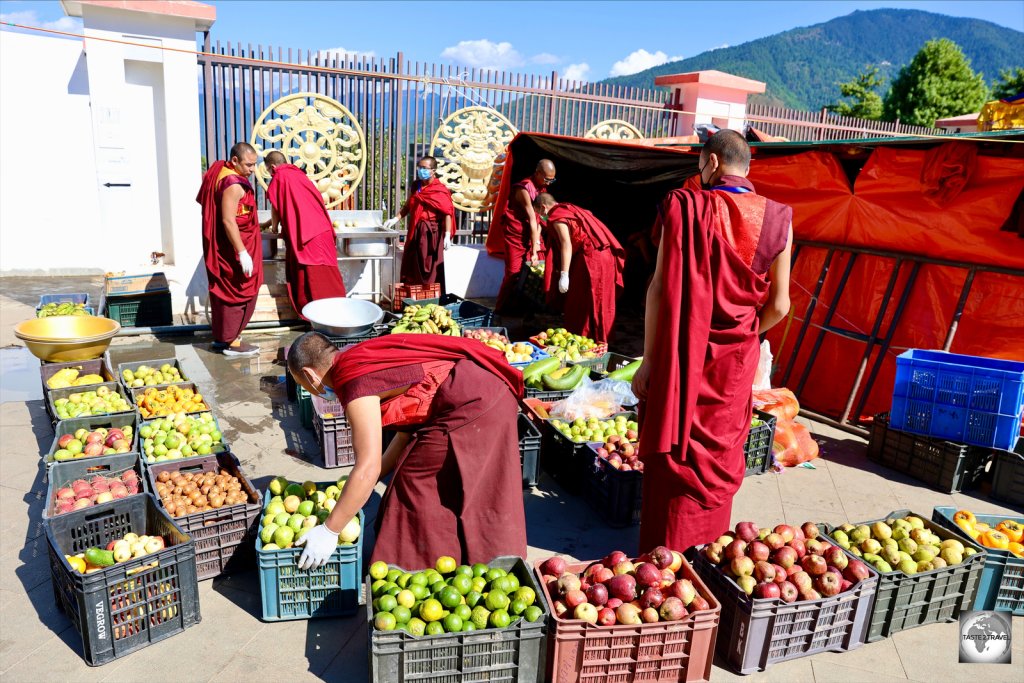 Volunteer at the Buddha Dordenma temple distribute free fruit to worshipers.