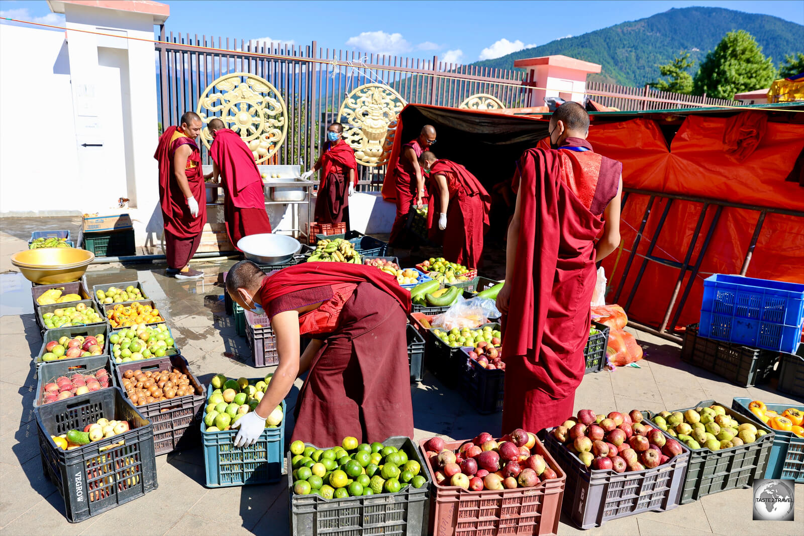 Volunteers at the Buddha Dordenma temple distribute free fruit to worshipers.