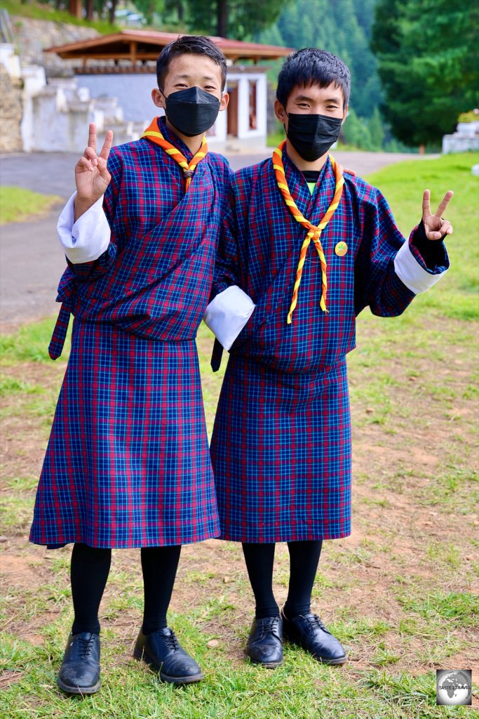 Two school boys in Paro wearing their traditional dress school uniforms.