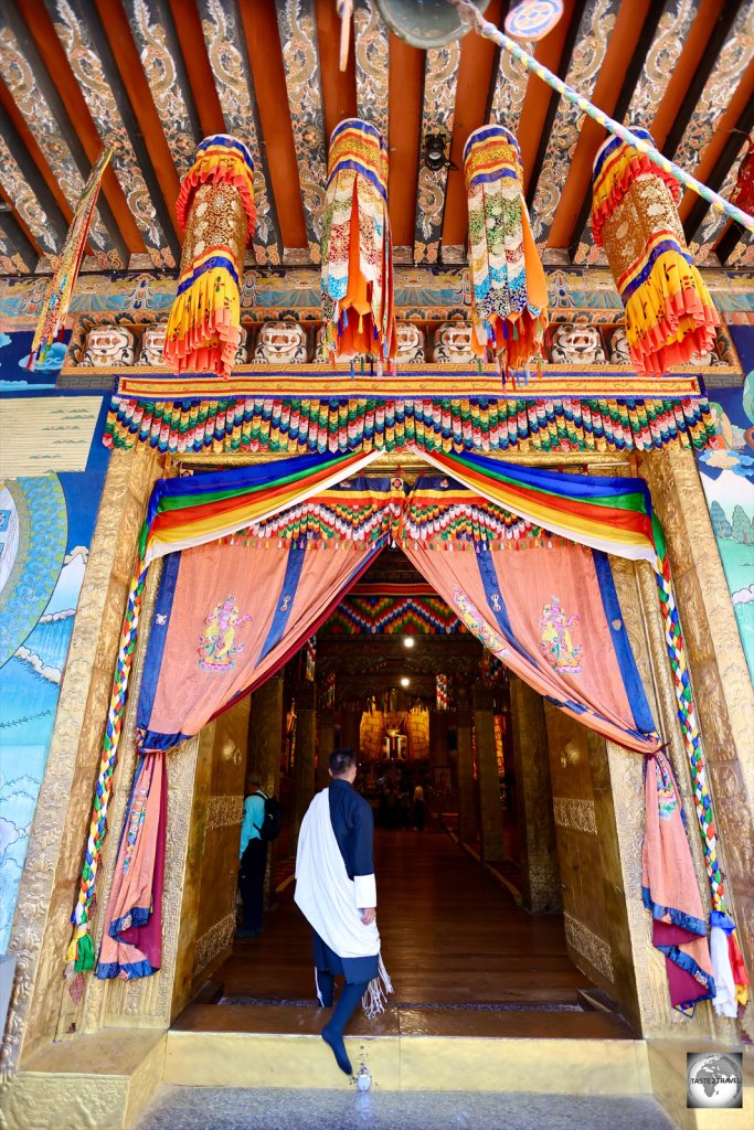 My guide, Jamyang, entering the temple at Punakha Dzong.