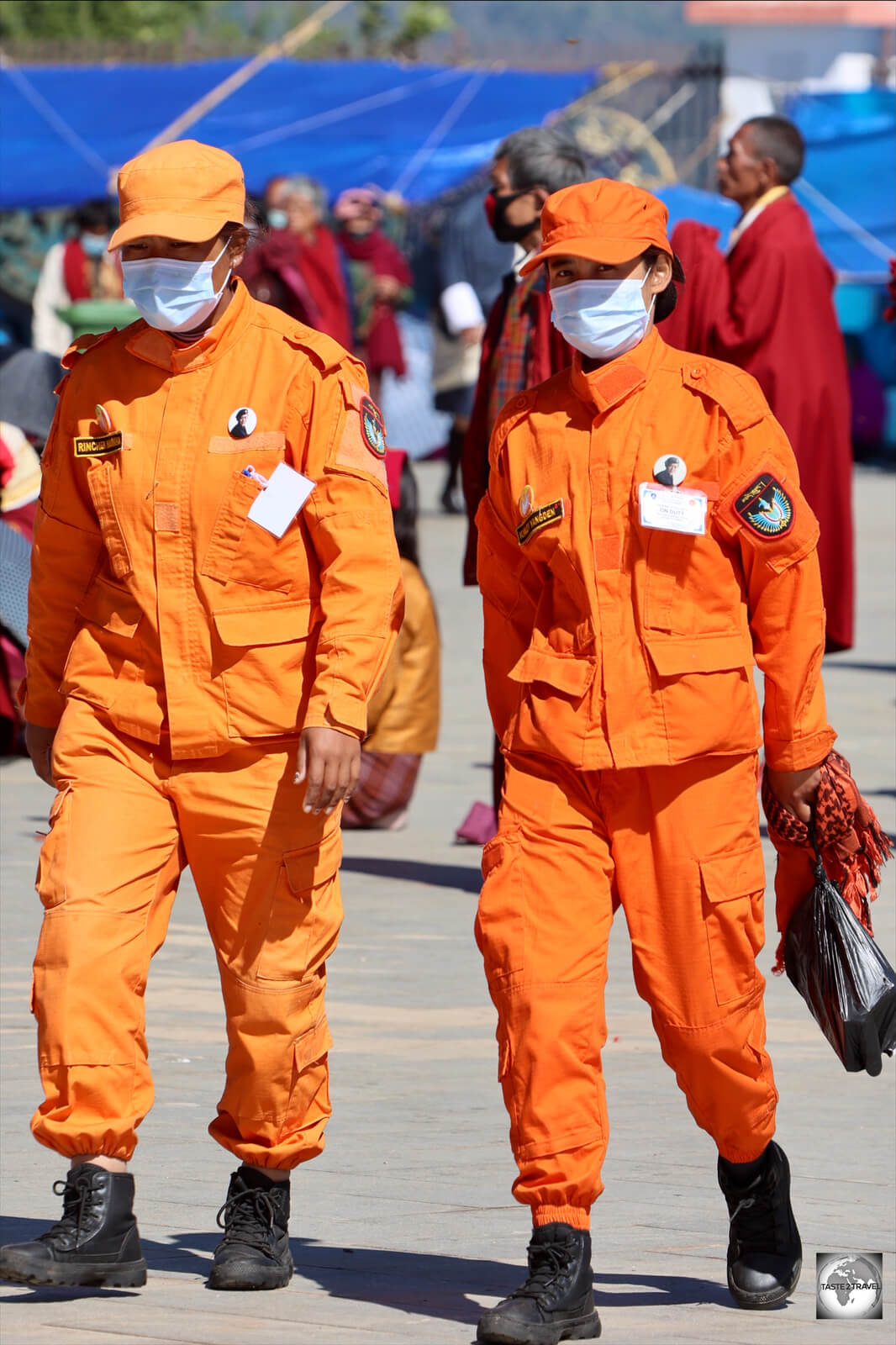 Volunteer attendants at the monthly pray meeting are easily identifiable in their orange uniforms.
