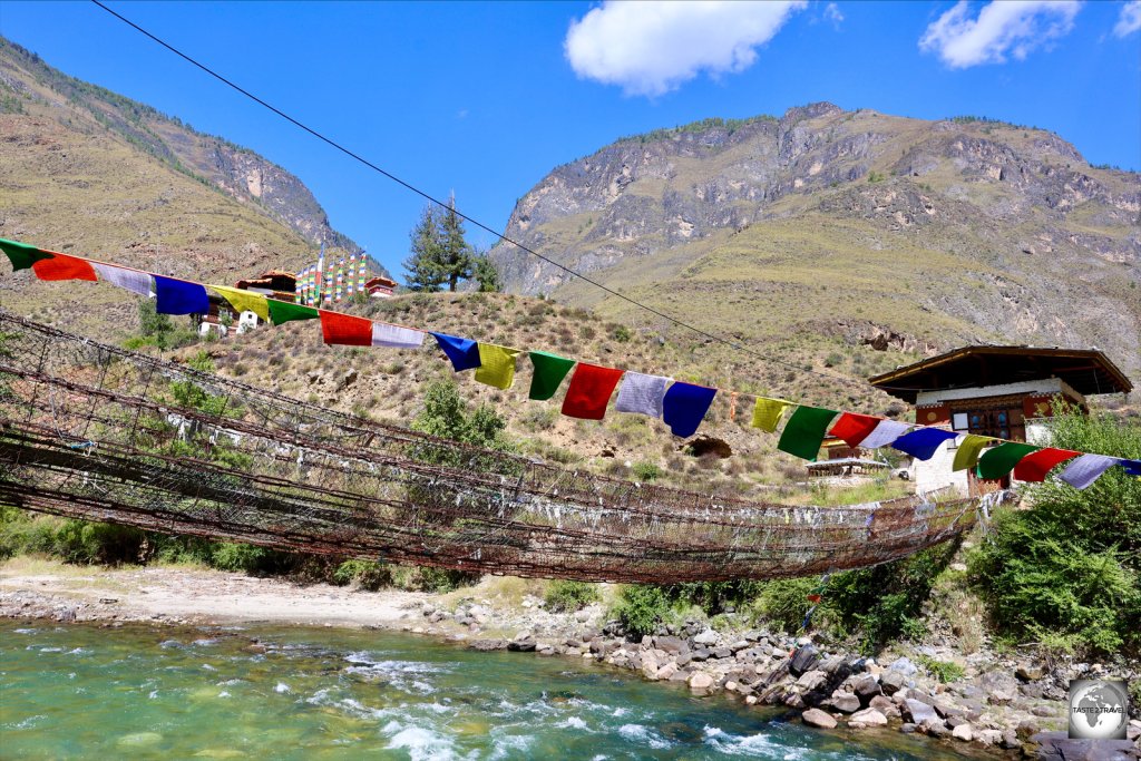 The Iron Bridge over the Paro River, with Tachog Lhakhang (temple) in the background.