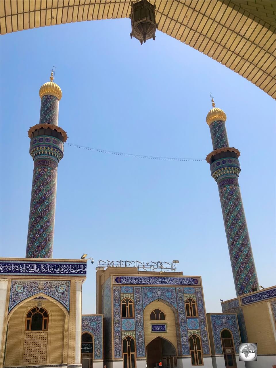 A view of the central courtyard and the two, fully tiled, minarets at the Grand Mosque of Kufa.