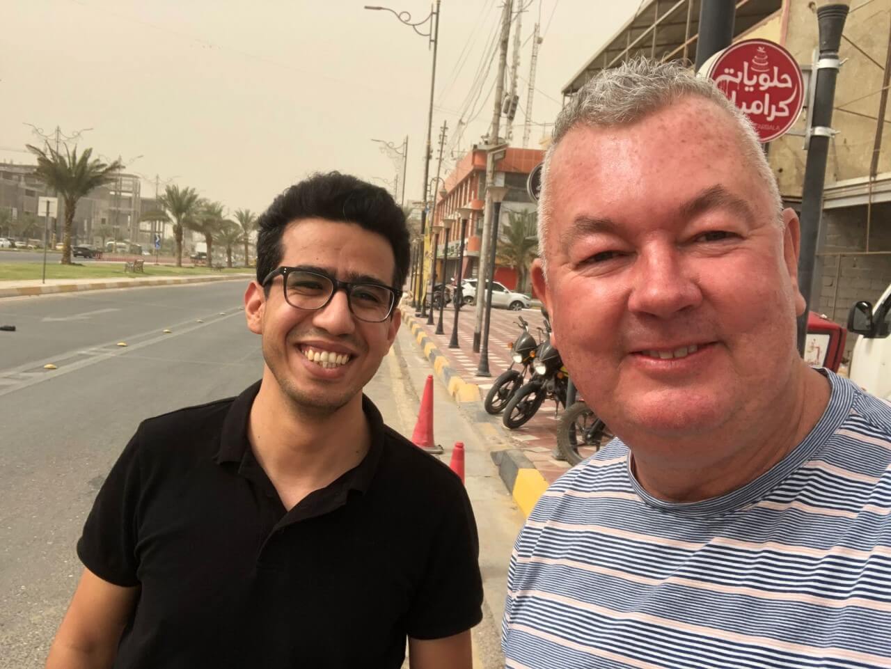 With Jawad, outside his family's business - Caramel Café, in Karbala.