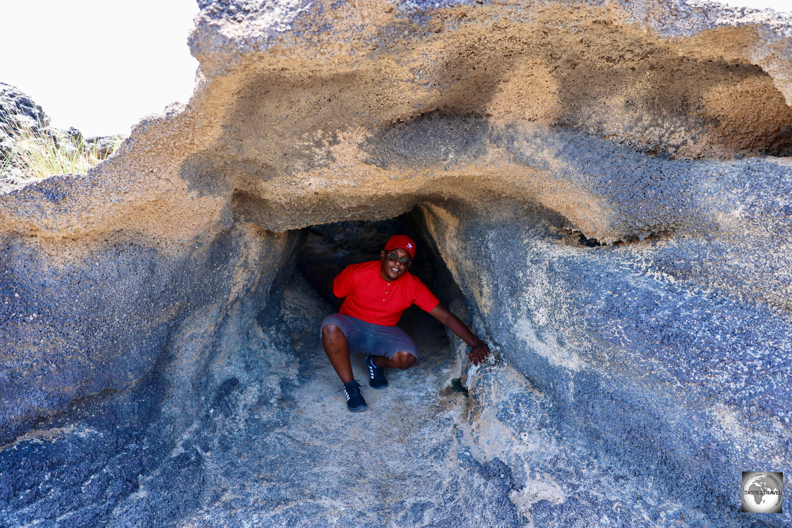 My Guide, Akram, exploring one of the small lava tunnels which was formed during the eruption of the Ardoukoba volcano.