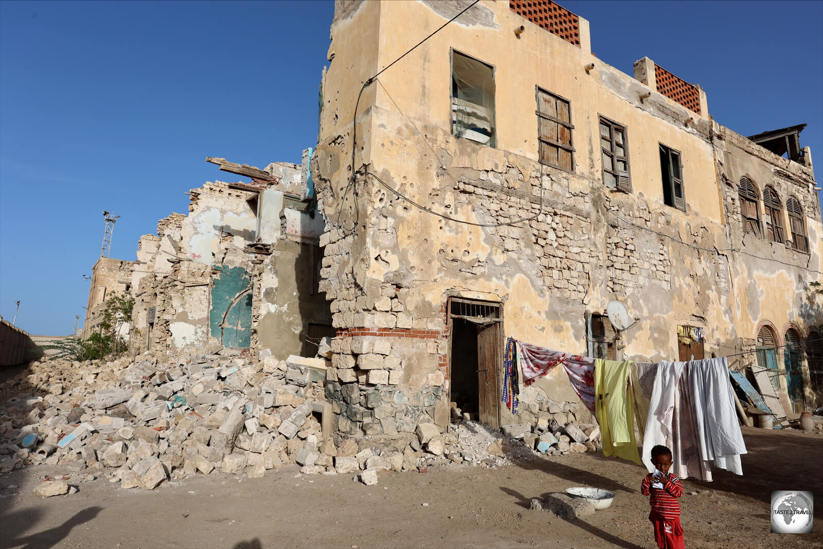 Residents of Massawa old town continue to live among the remains of war-ravaged buildings.