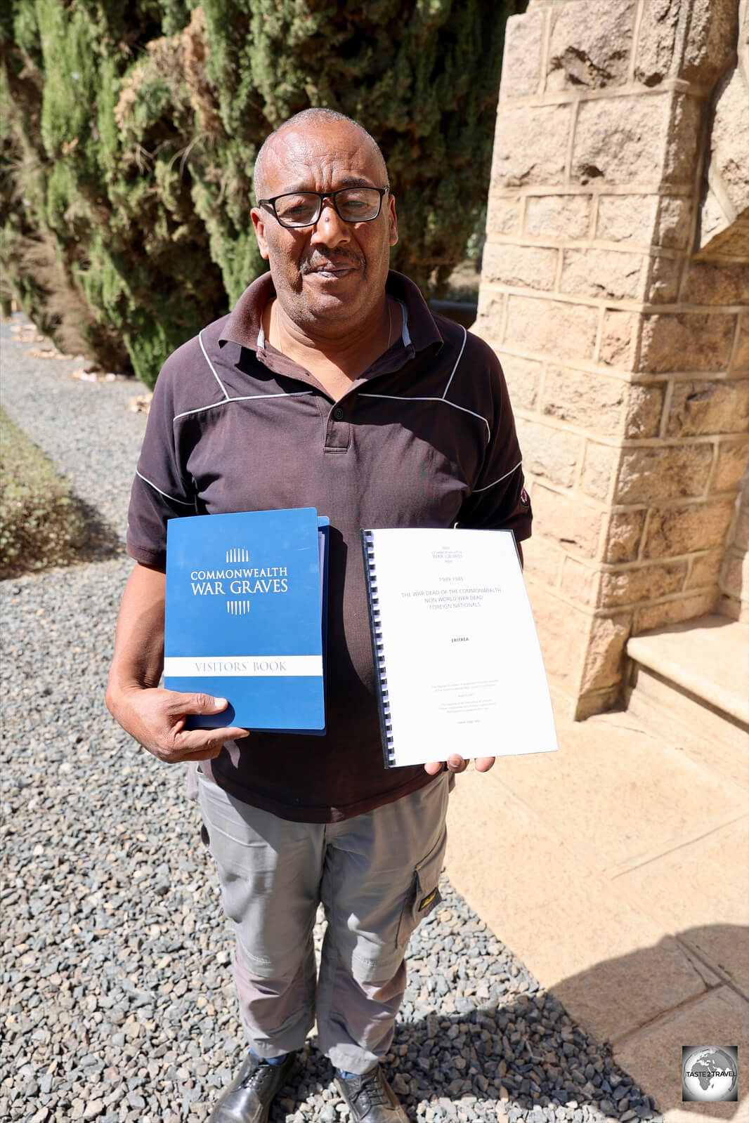 The cemetery caretaker, showing me a register of all buried soldiers.