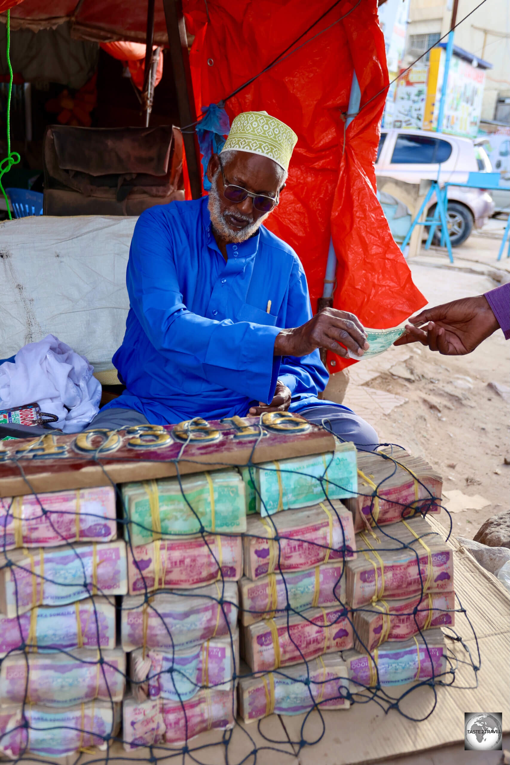 It's strange to hand over one crisp USD bank note and receive a wad of dirty, musty-smelling Somaliland shillings in return.