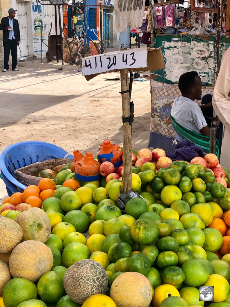 A fruit stand in Hargeisa market displays a telephone number where digital payments can be received.
