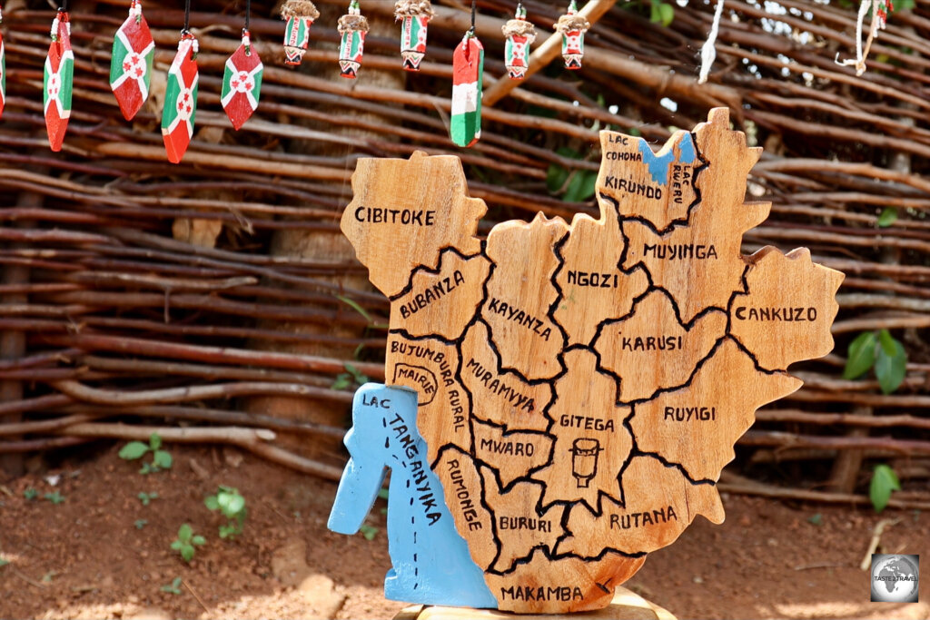 A wooden map of Burundi shows the different regions.