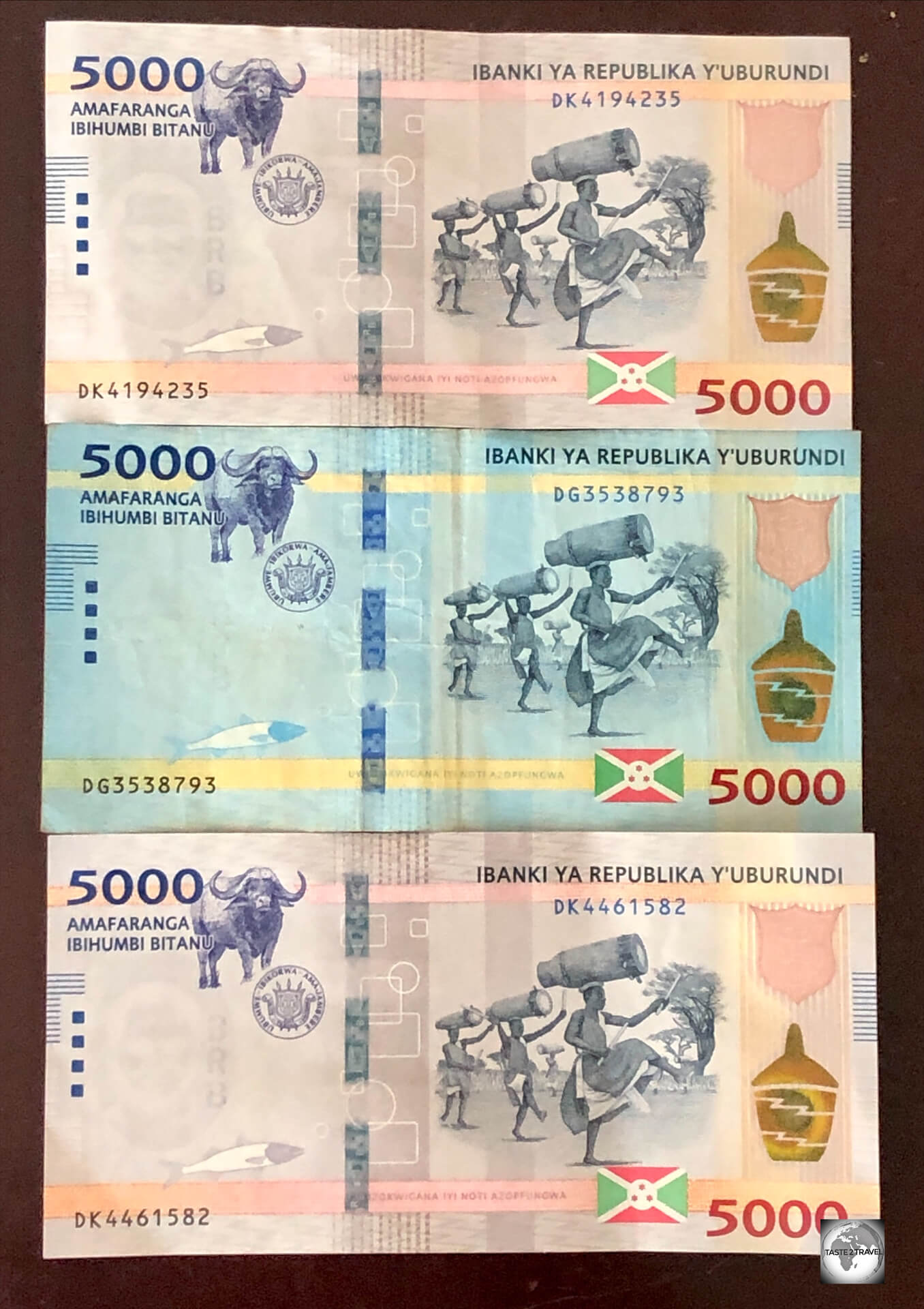Released during my visit, two new beige 5,000 BIF banknotes, with the older blue note in the centre.