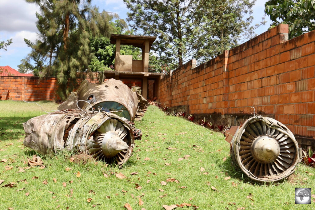 Wreckage from Juvenal Habyarimana’s presidential plane can still be seen where it crashed landed – just over the back wall of his palace.