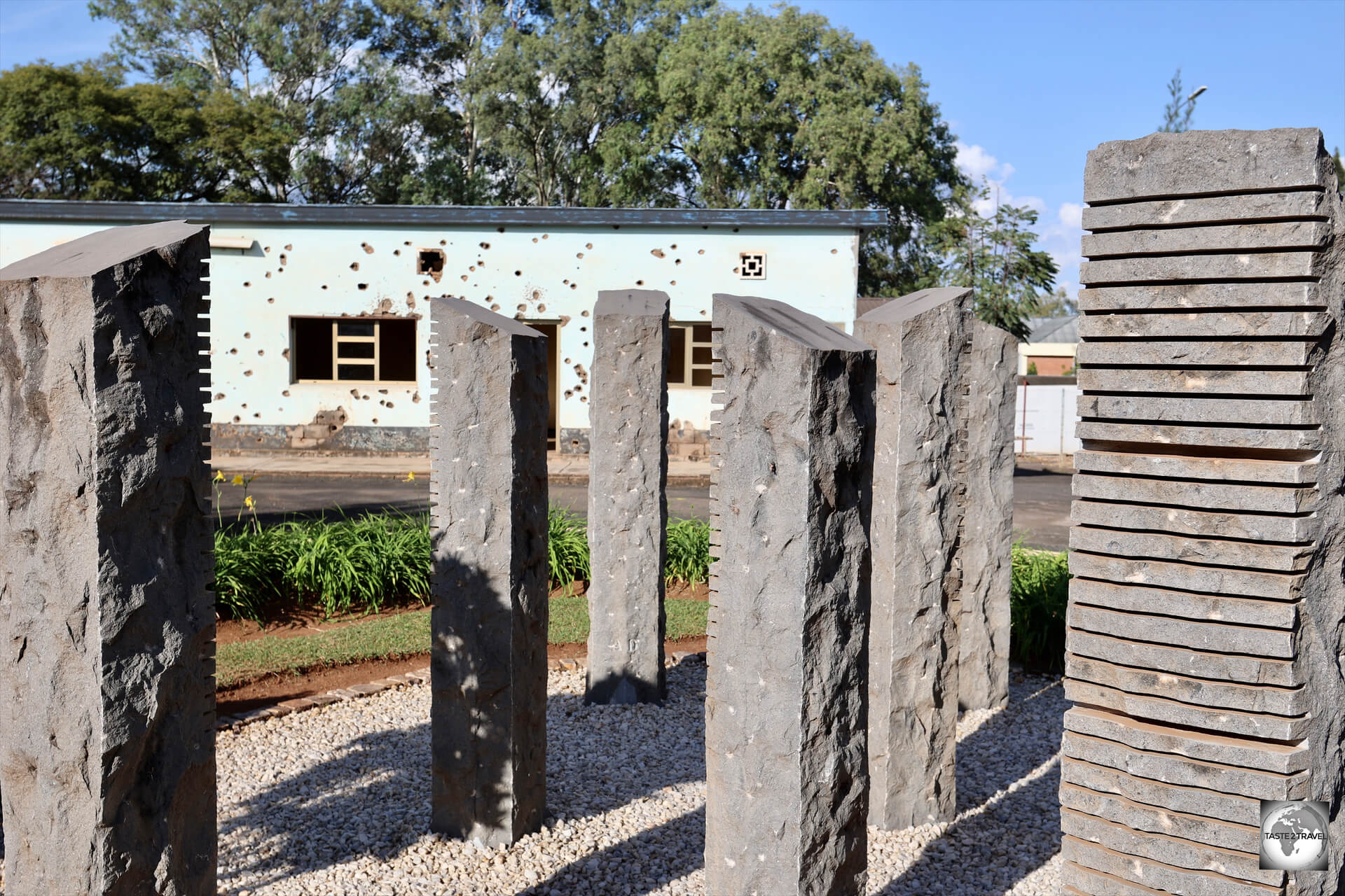 Ten, granite-stone, columns serve as a memorial to the ten Belgian UN Peacekeepers who were murdered in the early days of the 1994 genocide.
