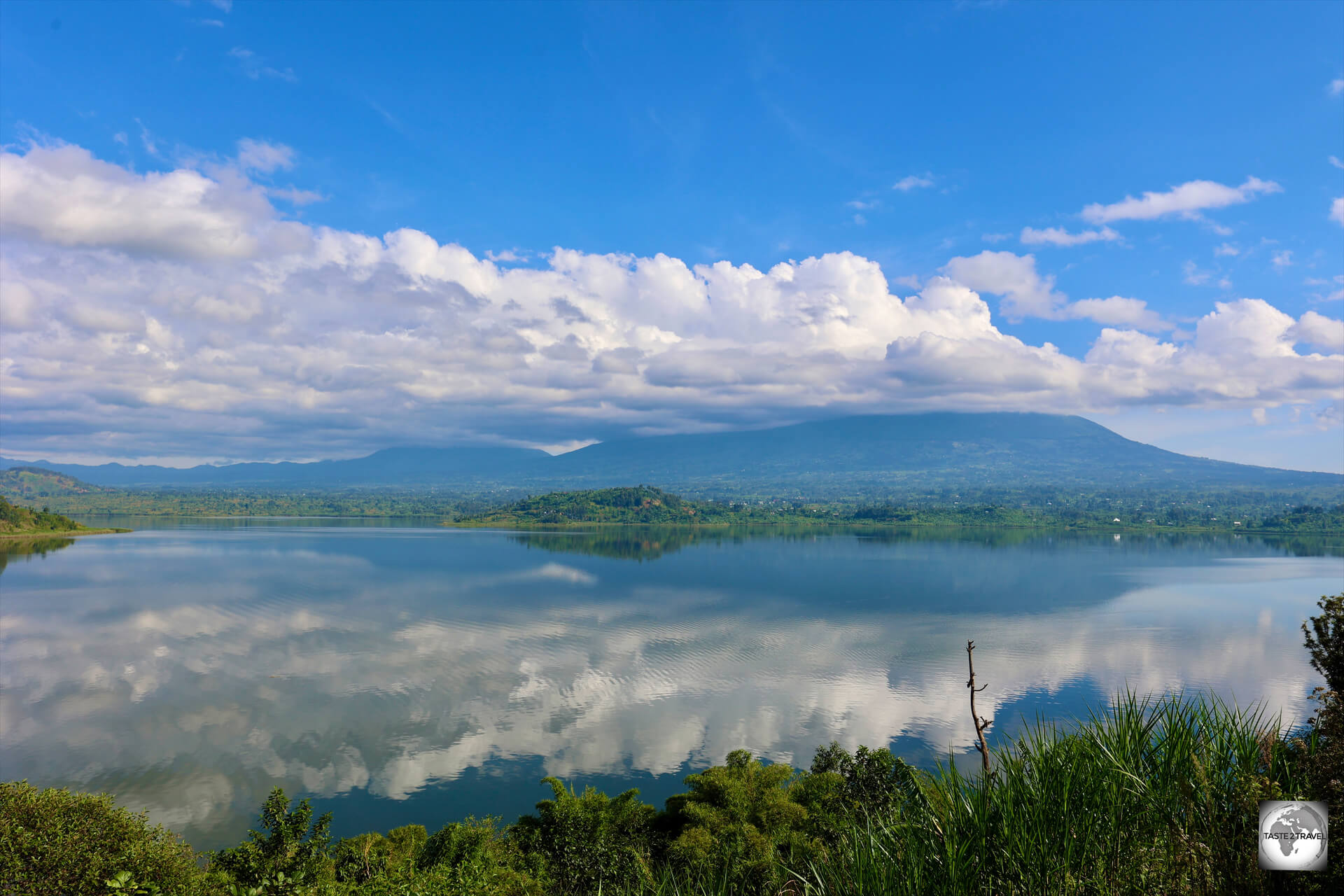 A view of Lake Ruhondo, and the, cloud-covered, Virunga Mountains, from "My Hill Eco Resort".