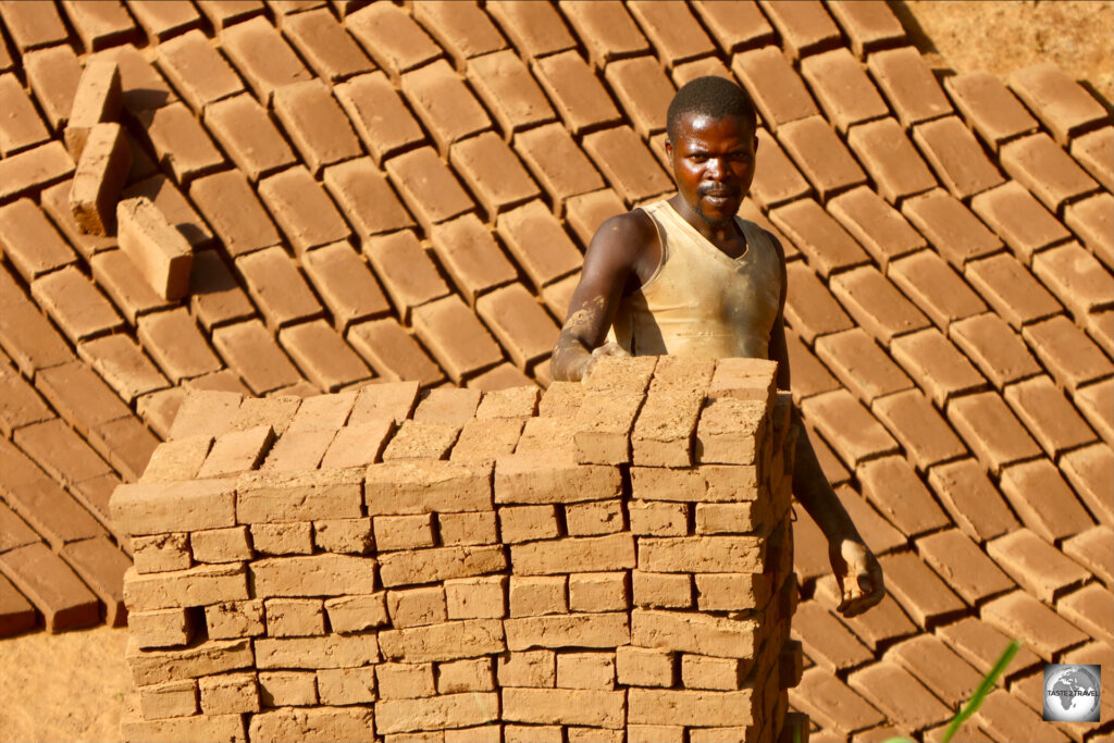 A brickmaker, at the roadside brickworks, near Lake Kivu.