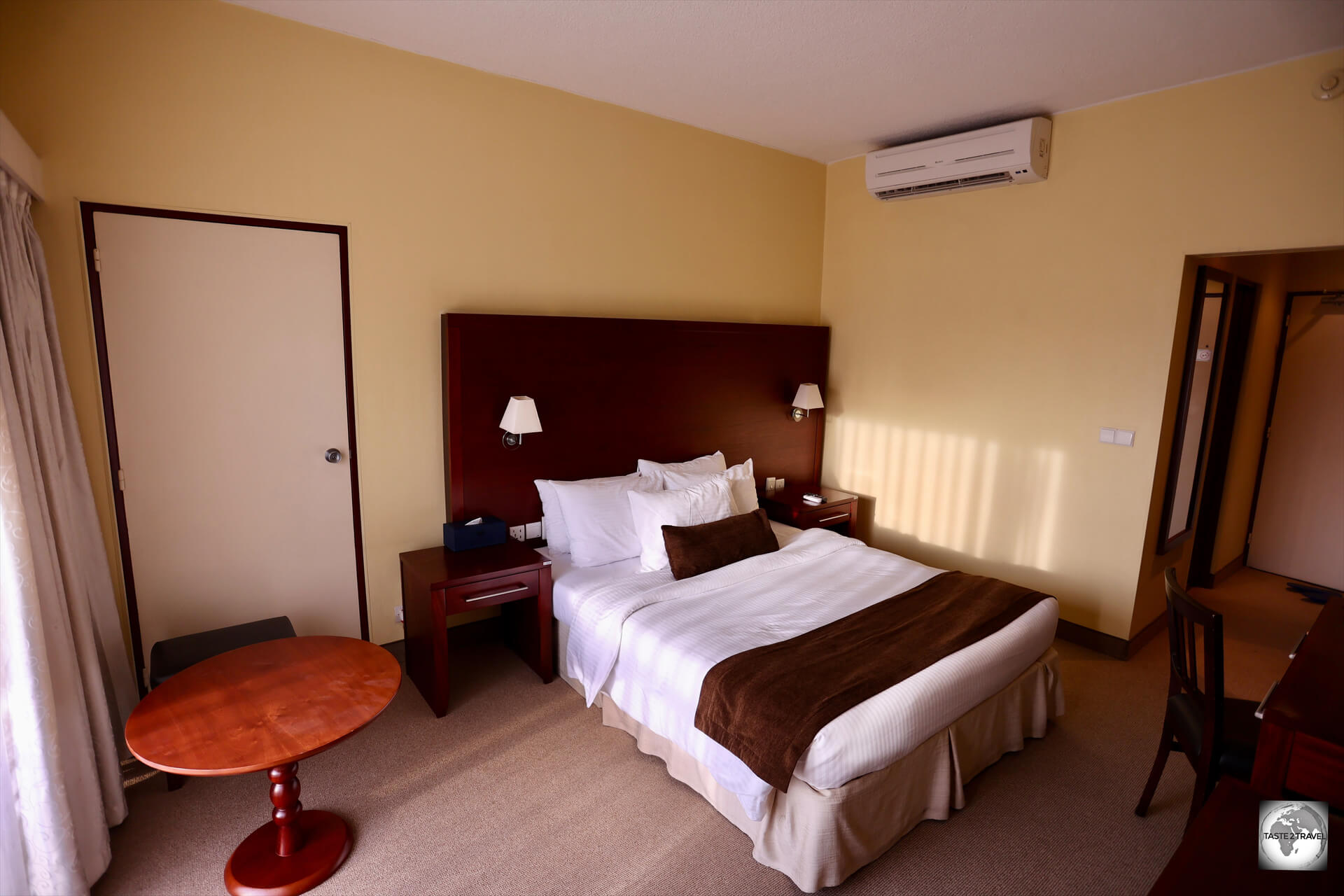 Staying in a piece of history, my room at the 4-star 'Hotel des Mille Collines', dated but comfortable.