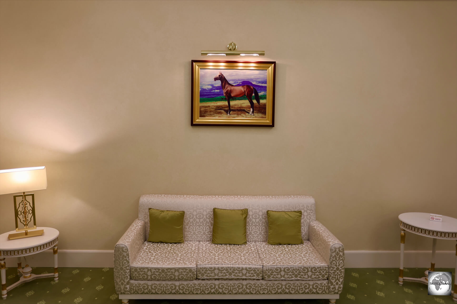 My suite at the Yyldyz Hotel was furnished with a sofa and decorated with paintings of Turkmen horses.