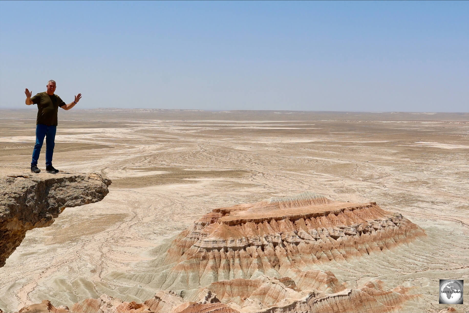 Standing on the edge at the very remote Yangykala Canyon.