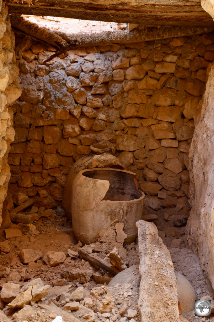 Terracotta pots, which one held olive oil, remain inside once of the chambers at Kabaw.