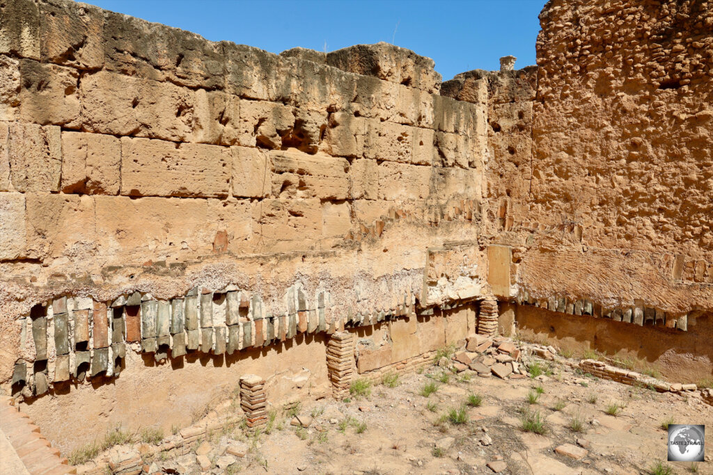 A view of the steam room in the bathhouse at Leptis Magna, which shows terracotta pipes still attached to the walls.