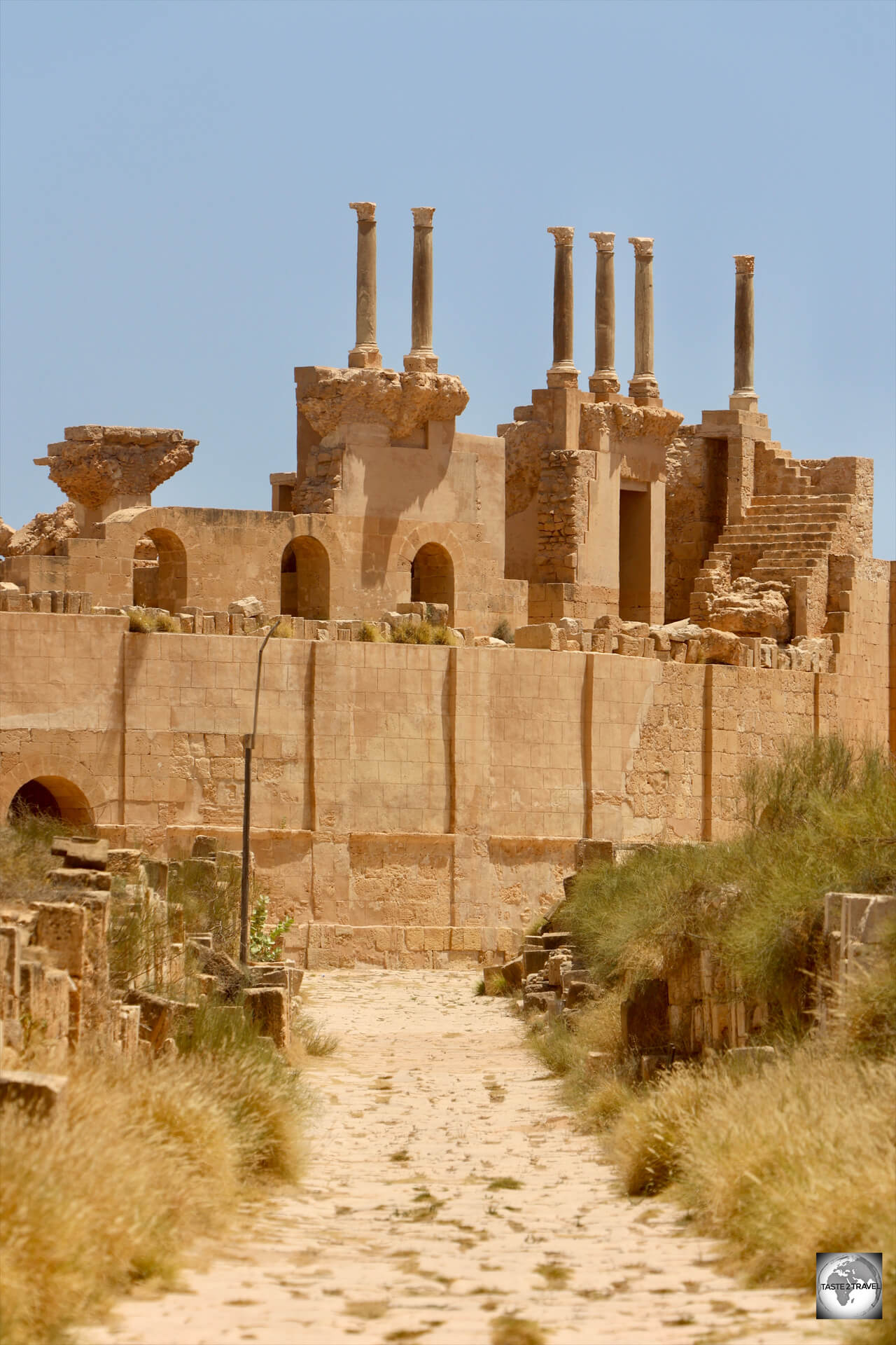 An ancient Roman road leads directly to the Roman theatre at Sabratha, Libya.
