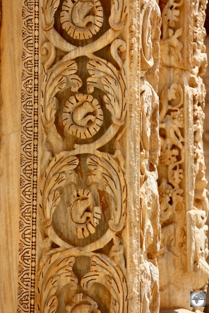 The intricately carved Column of Dionysus stands at the entrance to the Severan Basilica .