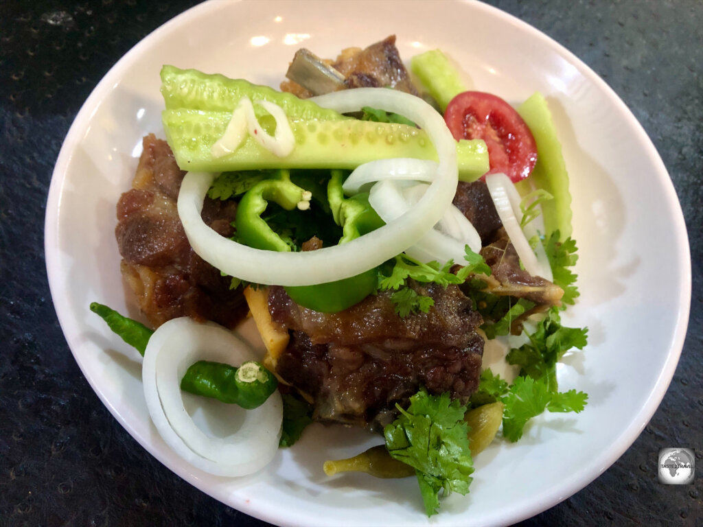 A specialty of the Bilal restaurant is a plate of succulent grilled lamb served with salad.