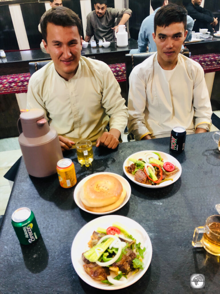 Sharing dinner with my guide and driver at Bilal Restaurant in Mazar.