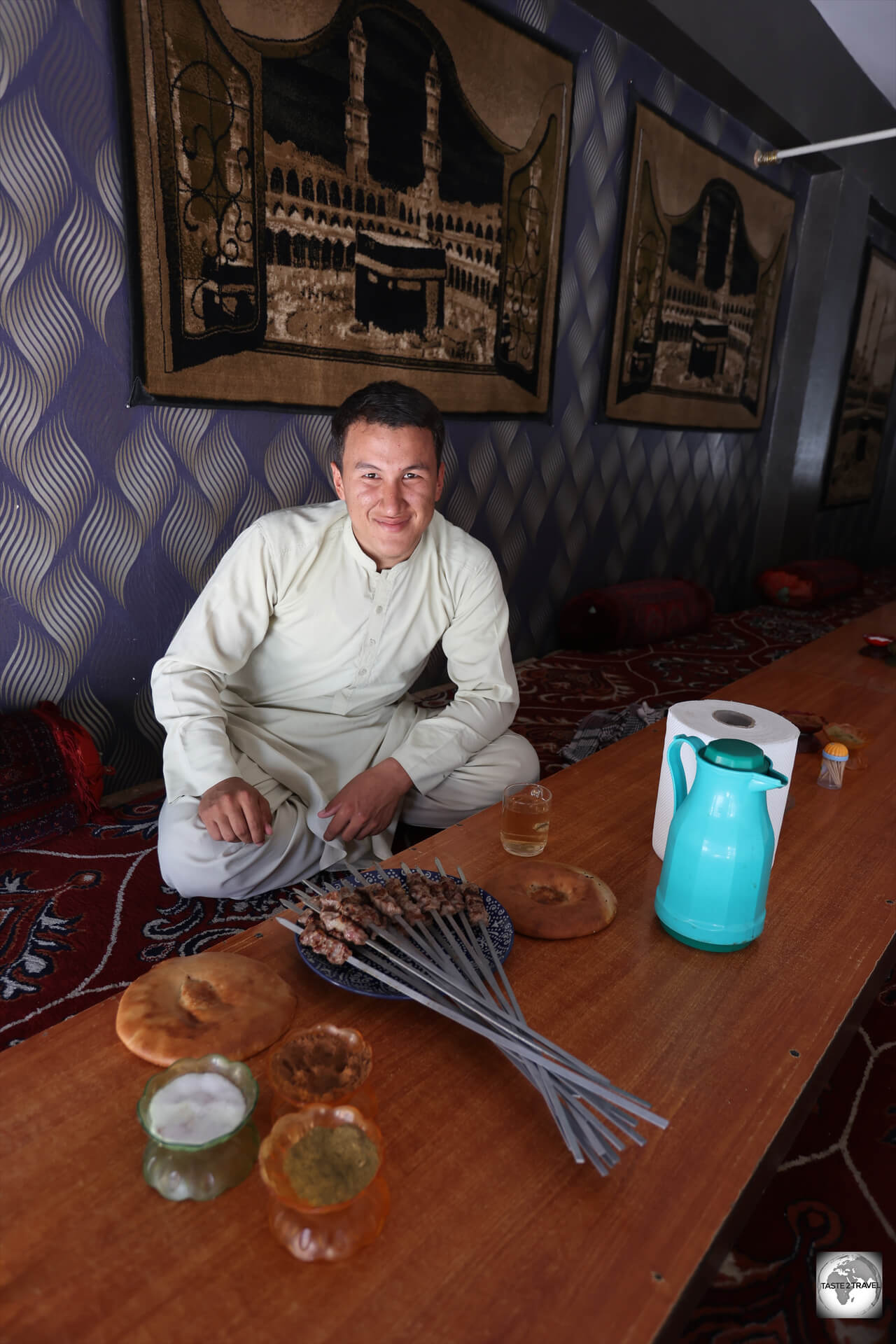 Sharing mutton kebabs for lunch, with my guide, Munir, in Mazar-i-Sharif.